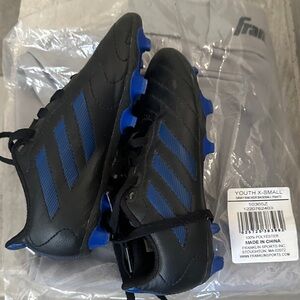 Black and Blue Youth Soccer Cleats and pants